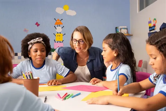 Teacher with children in a learning activity